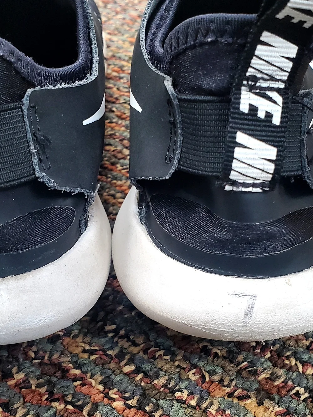 Nike Men’s Black and White Slip-On Athletic Sneakers